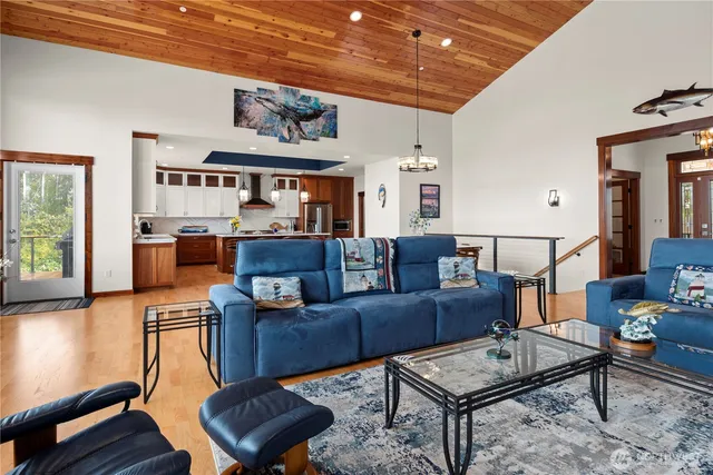 a bedroom with a bed and a dresser with mirror