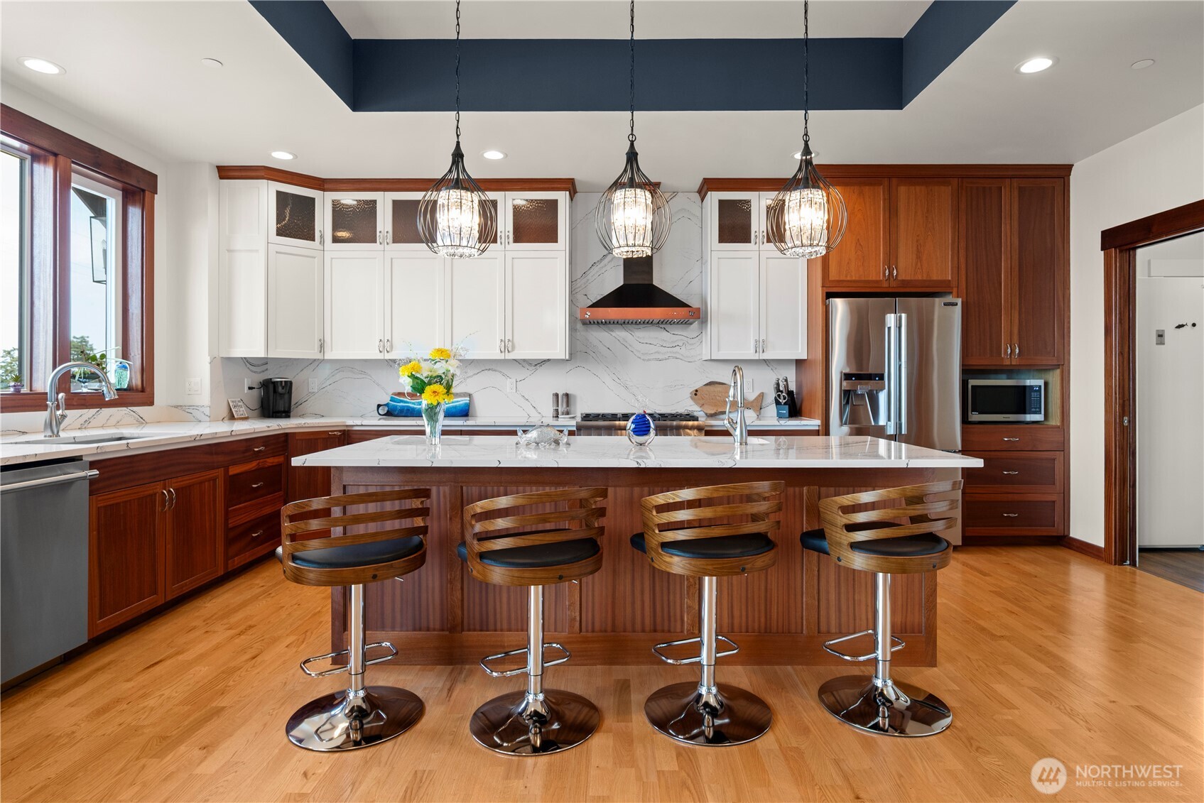 3803 West 2nd Street Anacortes, WA 98221 - Photo 14 of 40 a kitchen with stainless steel appliances granite countertop a sink and a refrigerator