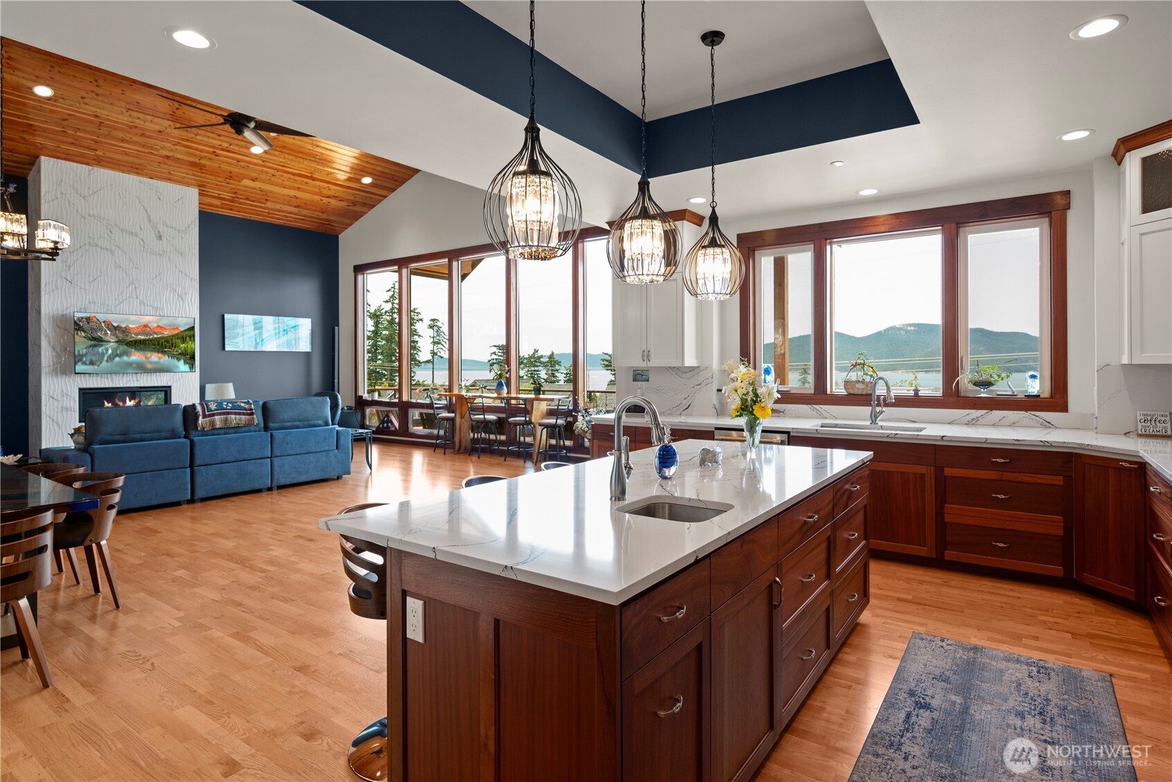 3803 West 2nd Street Anacortes, WA 98221 - Photo 15 of 40 an open kitchen with a sink and large windows