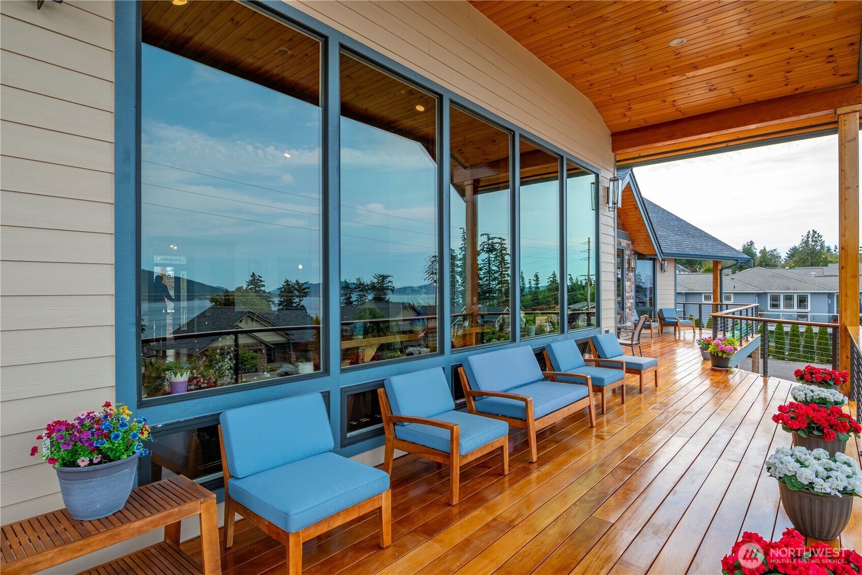 3803 West 2nd Street Anacortes, WA 98221 - Photo 20 of 40 a outdoor space with patio the couches and a potted plant on a wooden floor