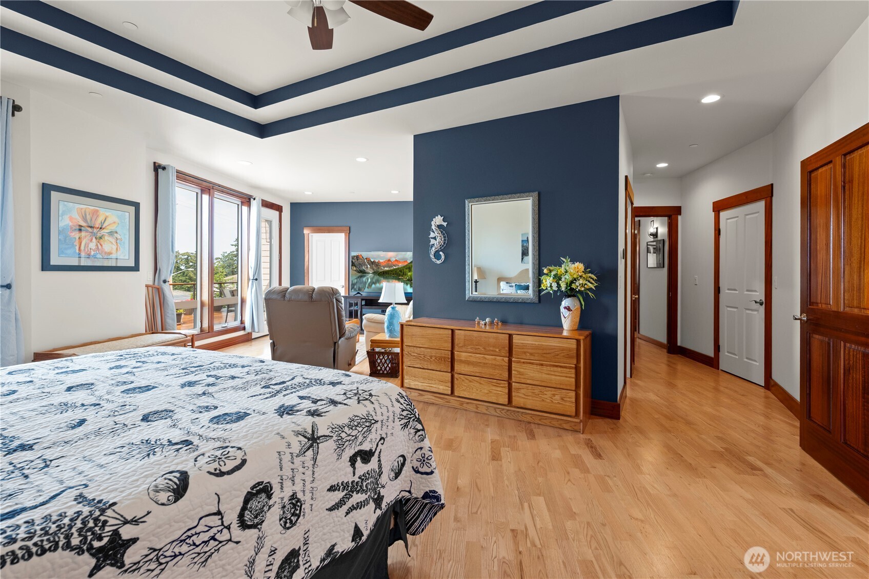 3803 West 2nd Street Anacortes, WA 98221 - Photo 21 of 40 a bedroom with a bed and a dresser with mirror