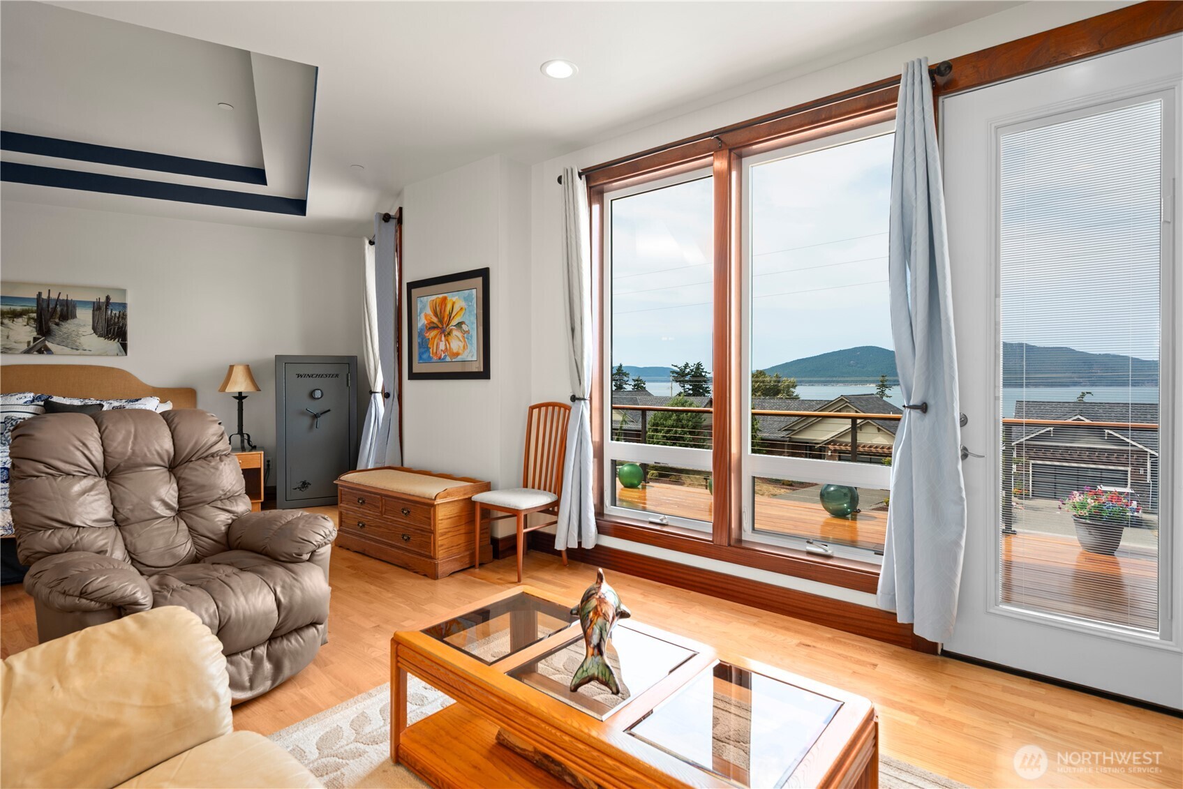 3803 West 2nd Street Anacortes, WA 98221 - Photo 22 of 40 a living room with furniture and a floor to ceiling window