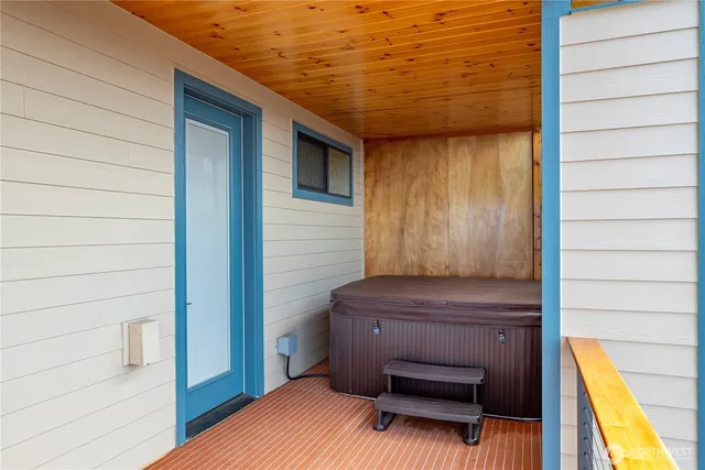 a bedroom with a large bed and a large window