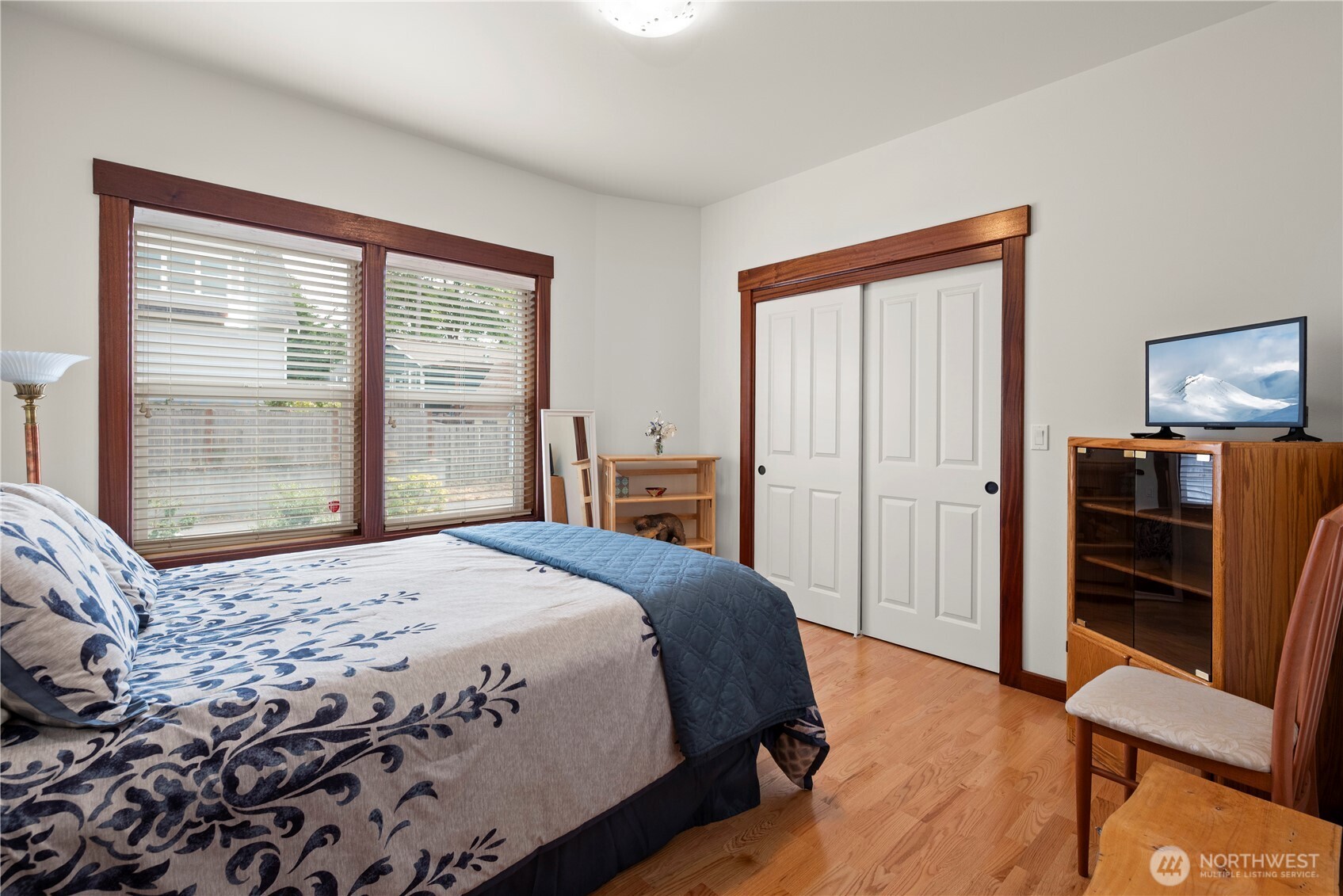 3803 West 2nd Street Anacortes, WA 98221 - Photo 27 of 40 a bedroom with a bed and wooden floor