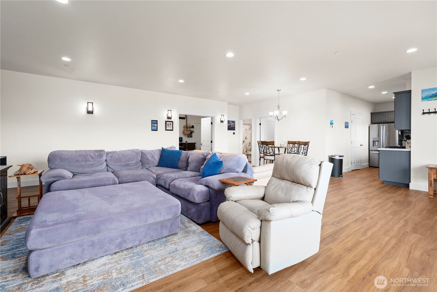 3803 West 2nd Street Anacortes, WA 98221 - Photo 30 of 40 a living room with furniture and a wooden floor
