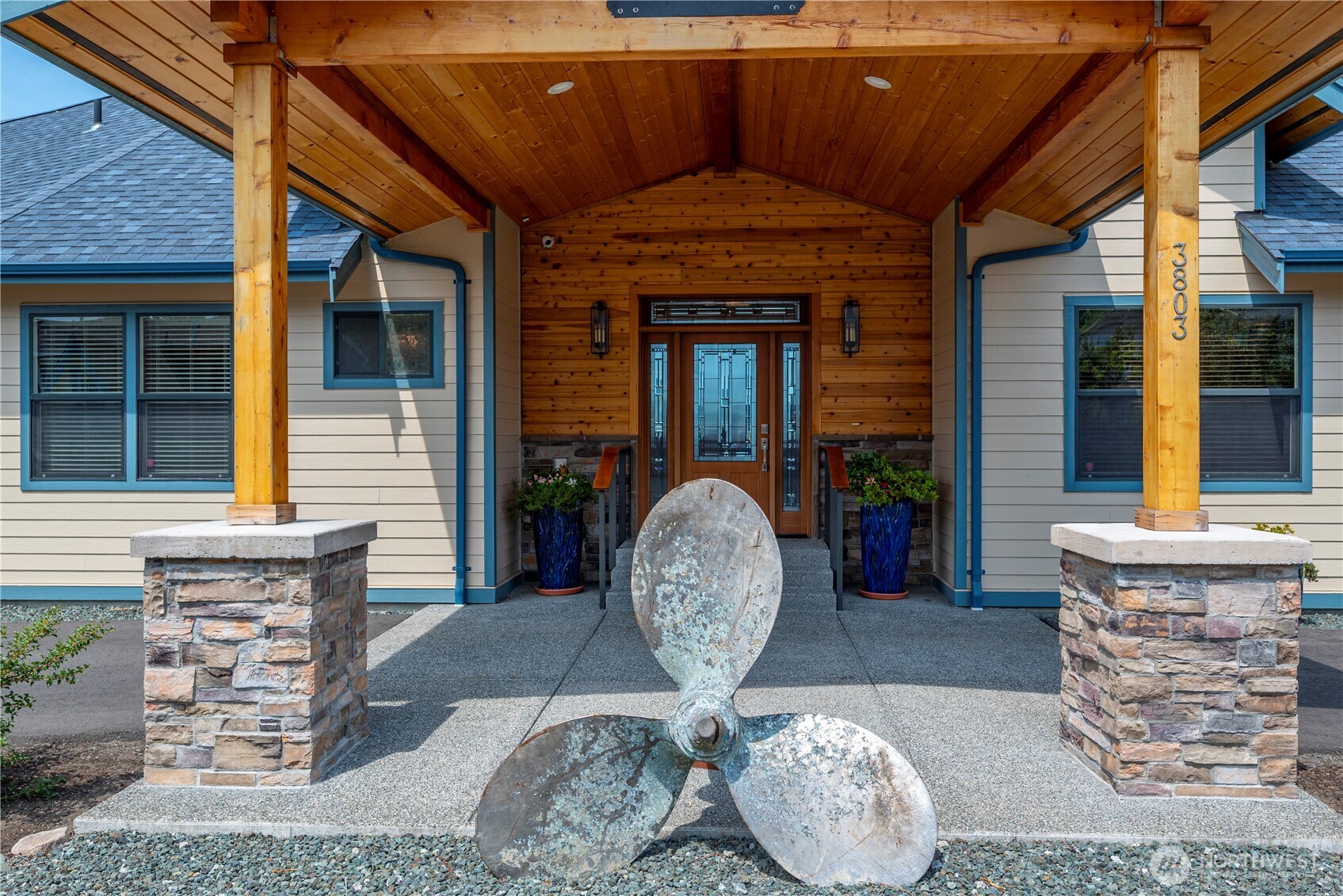 3803 West 2nd Street Anacortes, WA 98221 - Photo 5 of 40 a front view of a house with table and chairs