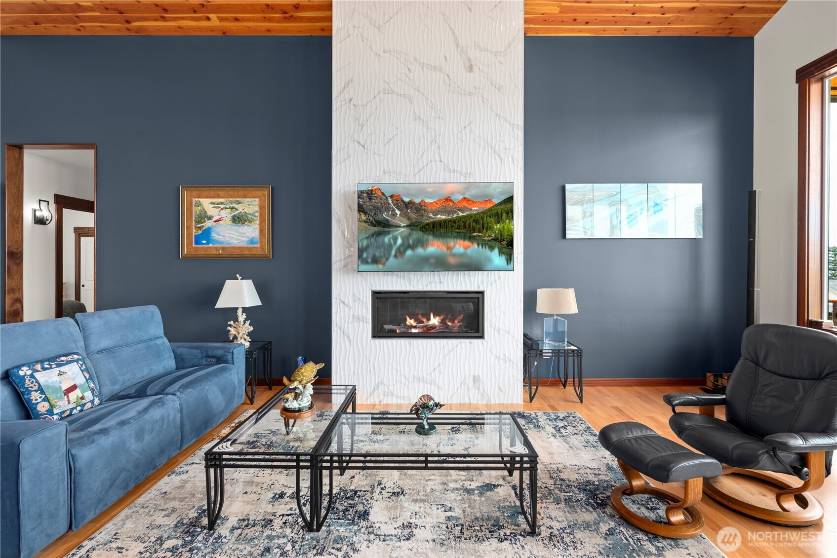 3803 West 2nd Street Anacortes, WA 98221 - Photo 9 of 40 a living room with furniture a rug and a fireplace