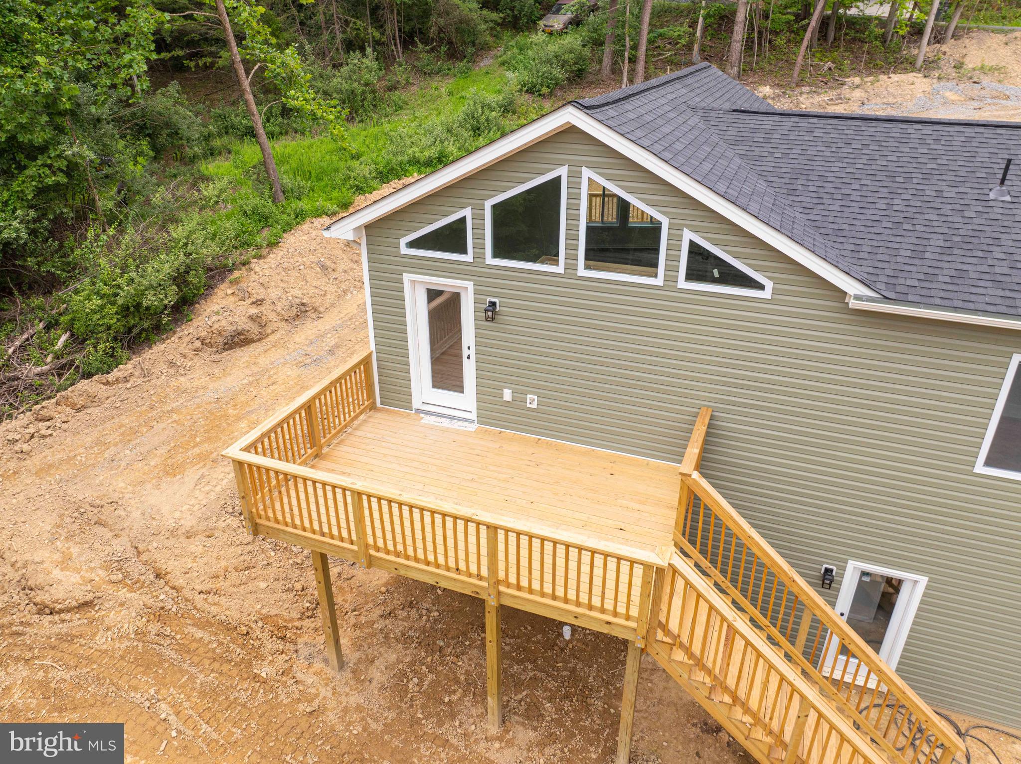 125 Spring Hollow Road Front Royal, VA 22630 - Photo 13 of 84 a view of a house with a yard