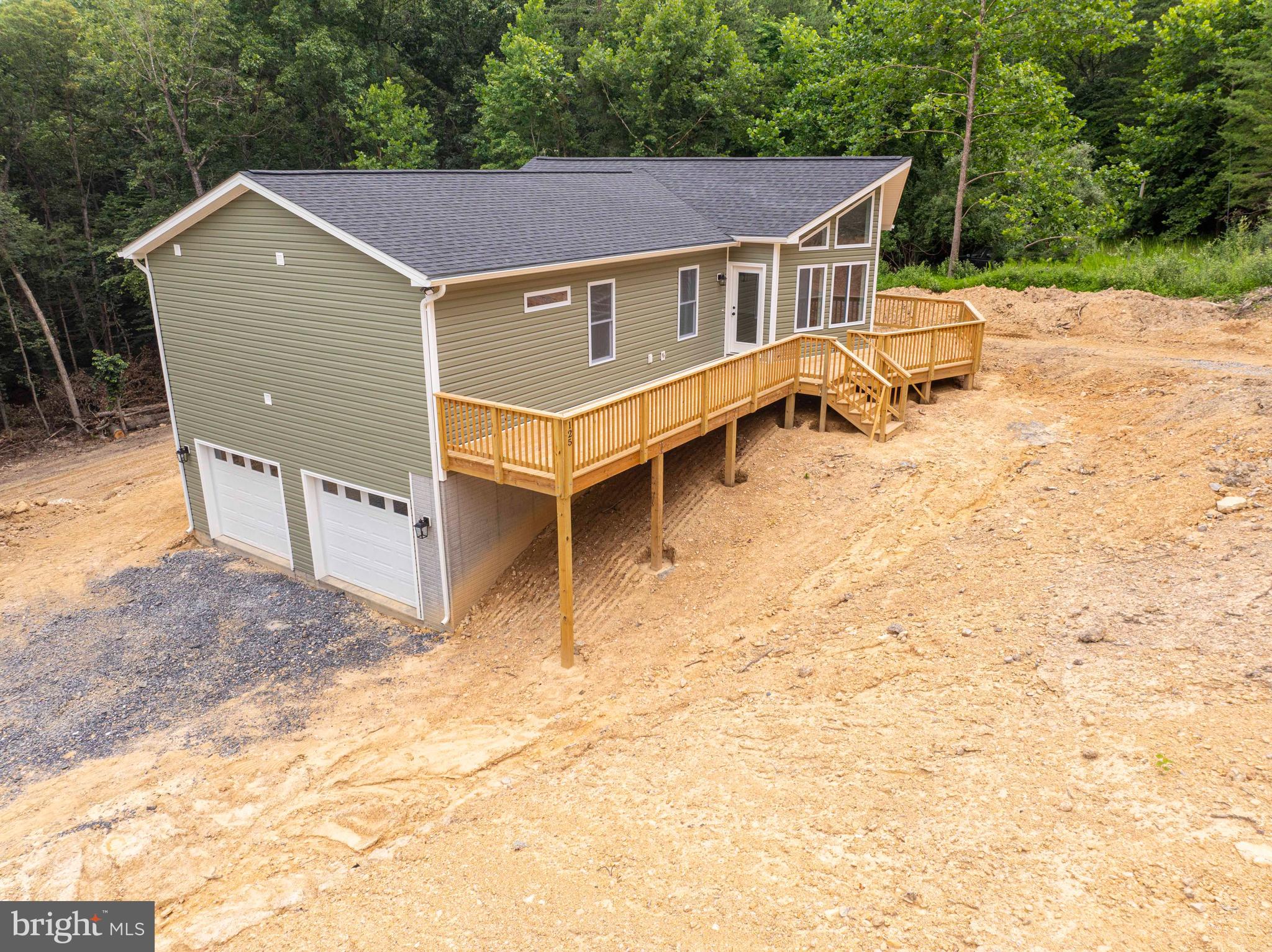 125 Spring Hollow Road Front Royal, VA 22630 - Photo 15 of 84 a view of a house with a yard and wooden fence