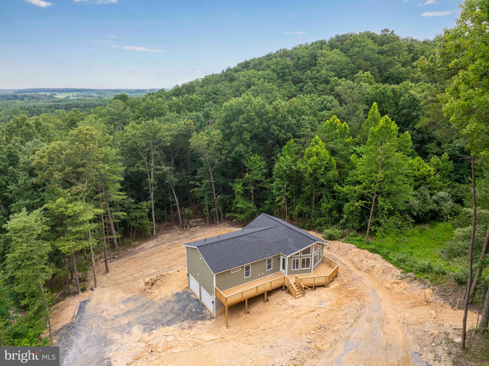 125 Spring Hollow Road Front Royal, VA 22630 - Photo 5 of 84 a backyard of a house with lots of green space