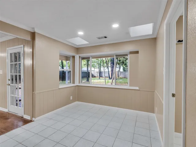 a view of a kitchen with a sink and a fireplace