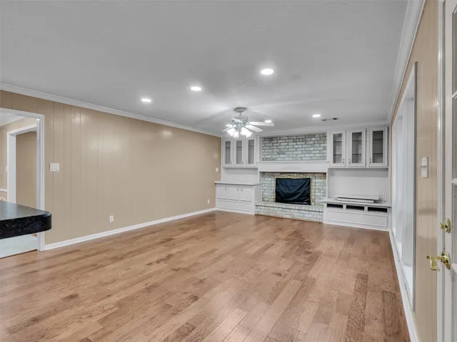 a spacious bathroom with a granite countertop sink and a mirror