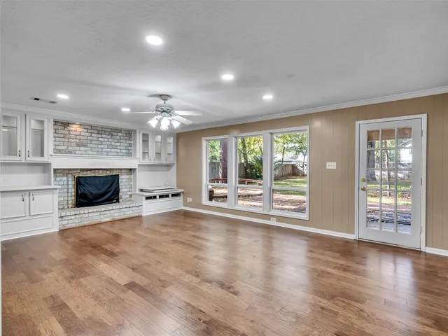 a bathroom with a granite countertop sink and a bathtub