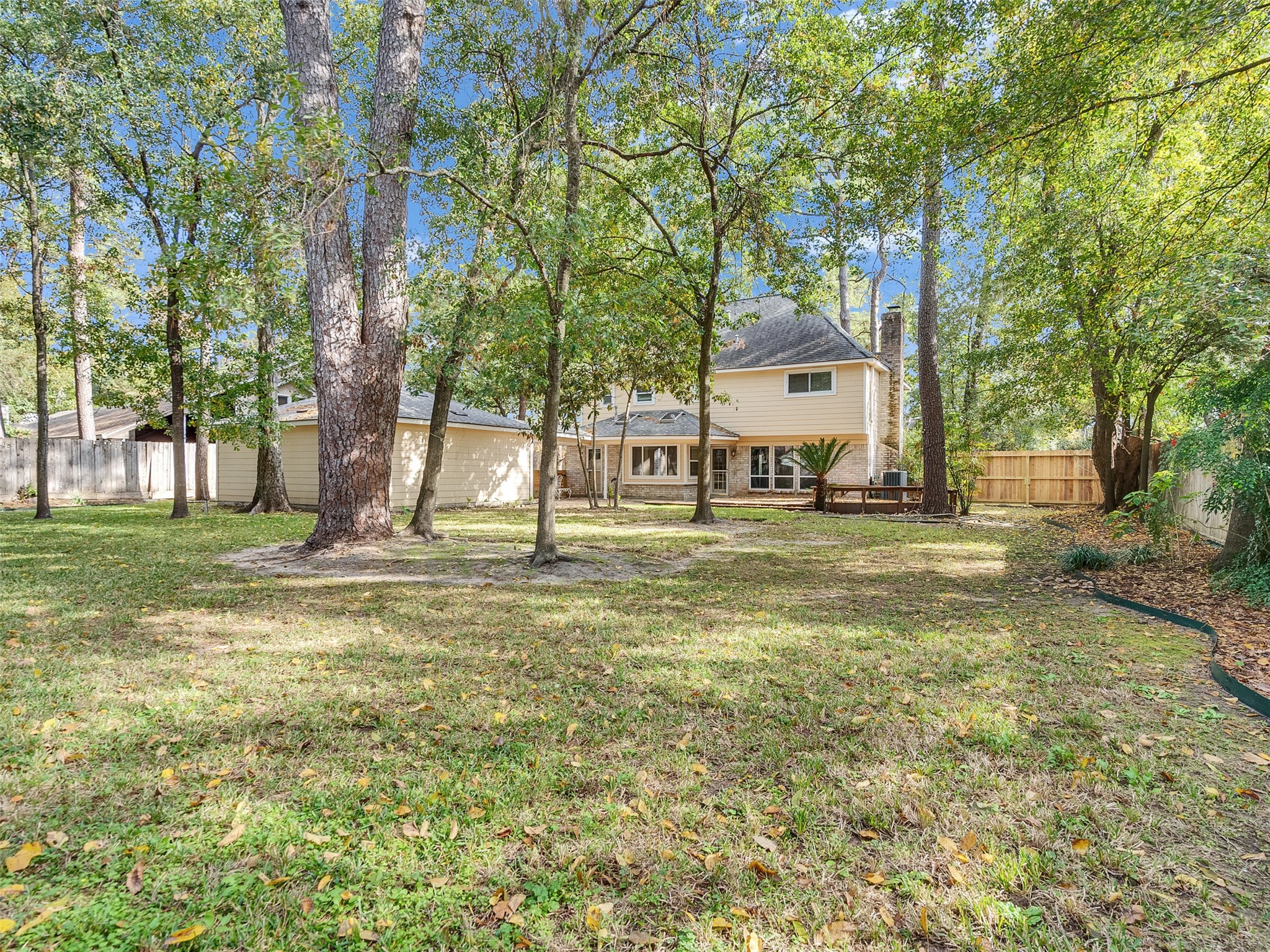 6702 Moccasin Bend Drive Spring, TX 77379 - Photo 35 of 35 a view of a house with a big yard and large trees