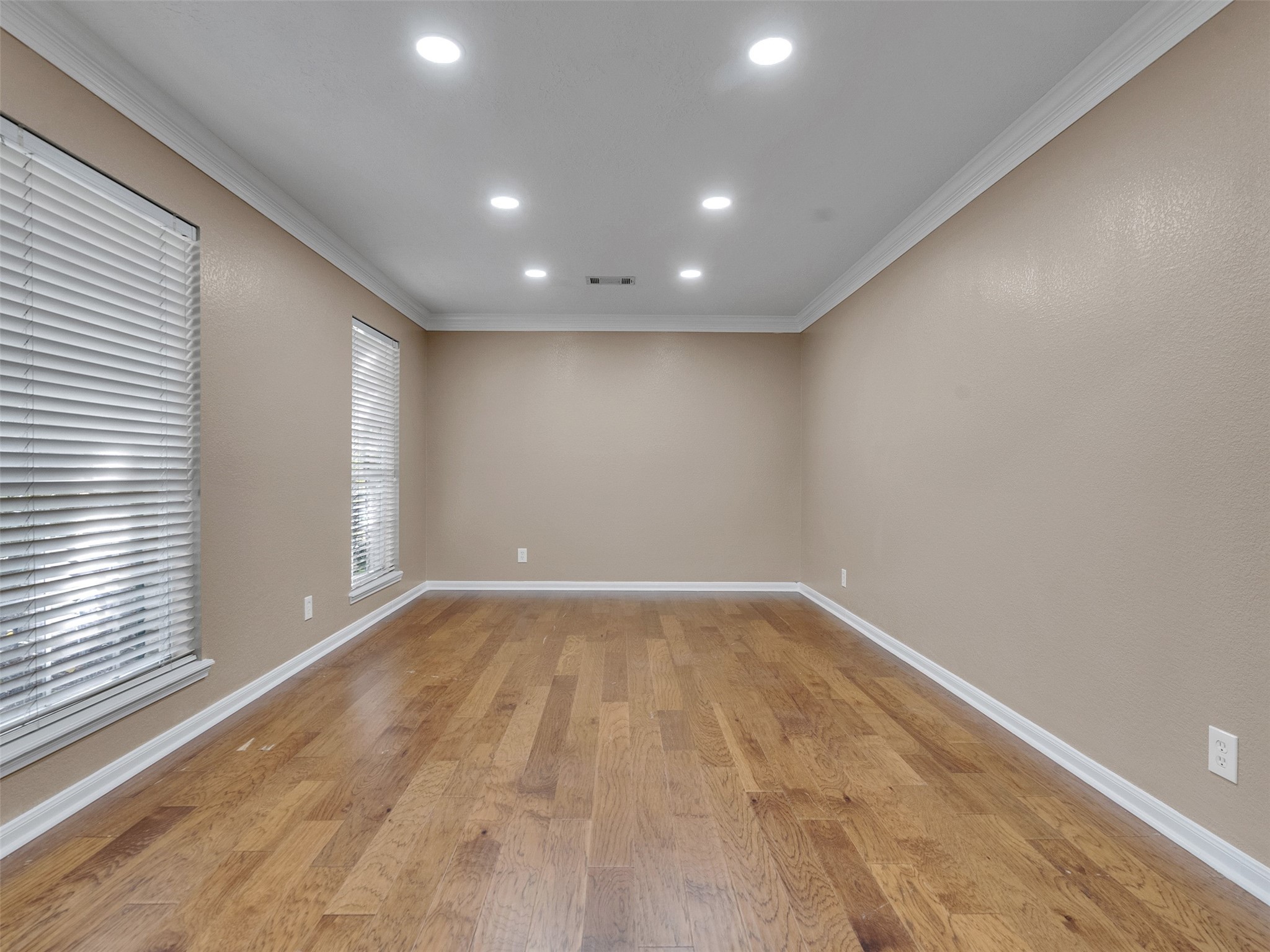 6702 Moccasin Bend Drive Spring, TX 77379 - Photo 6 of 35 a view of an empty room with wooden floor and a window