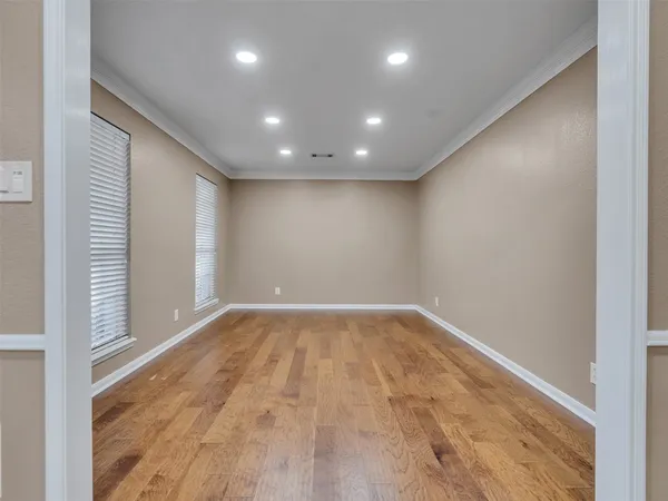 a kitchen with white cabinets and appliances