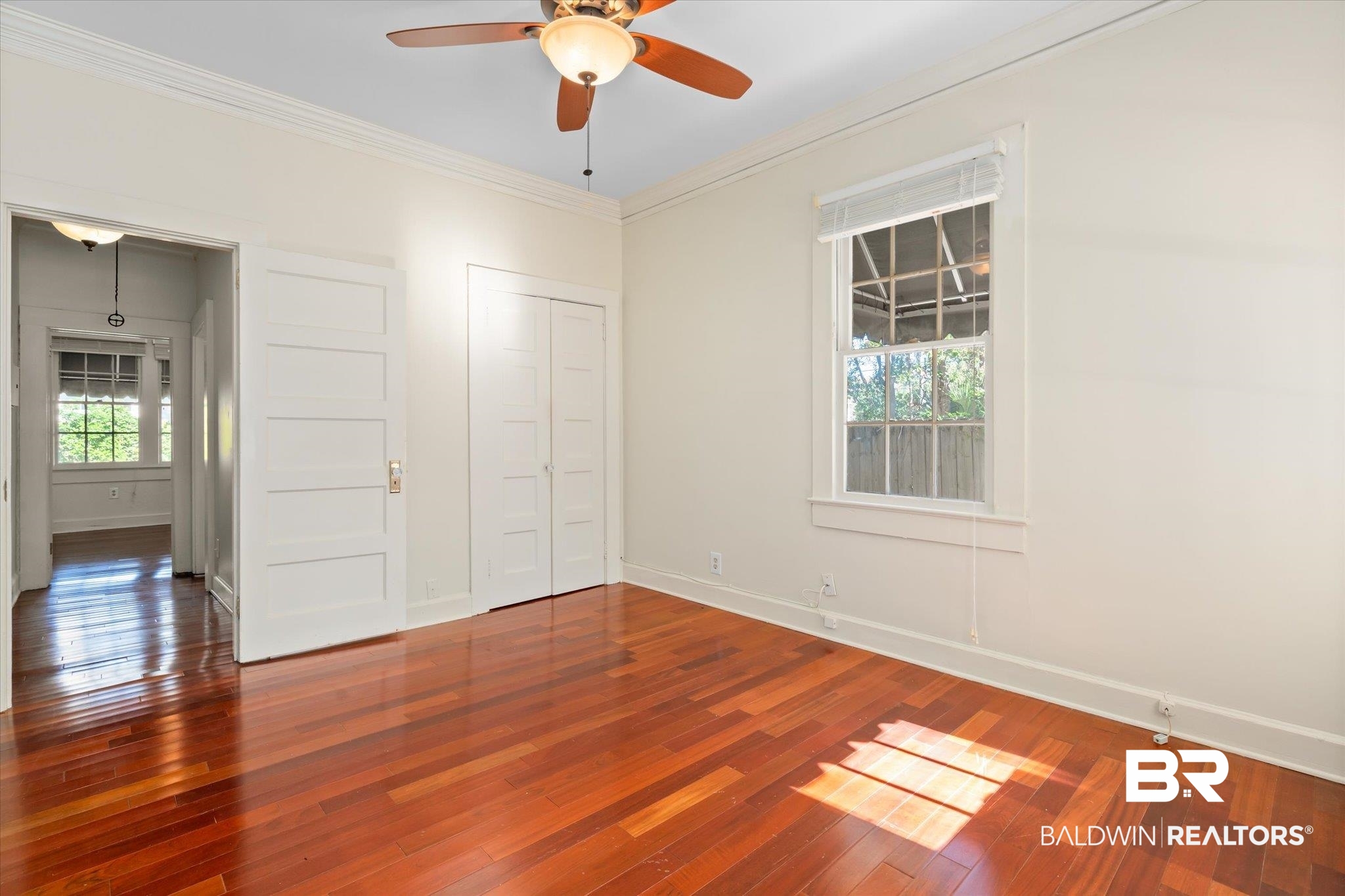 1220 Elmira Street Mobile, AL 36604 - Photo 12 of 20 Unfurnished bedroom with hardwood / wood-style floors, multiple windows, and ceiling fan