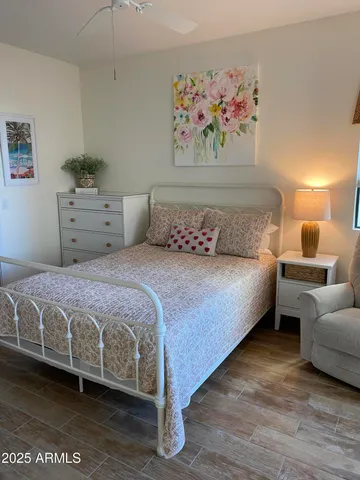 a bedroom with a large bed and a couch