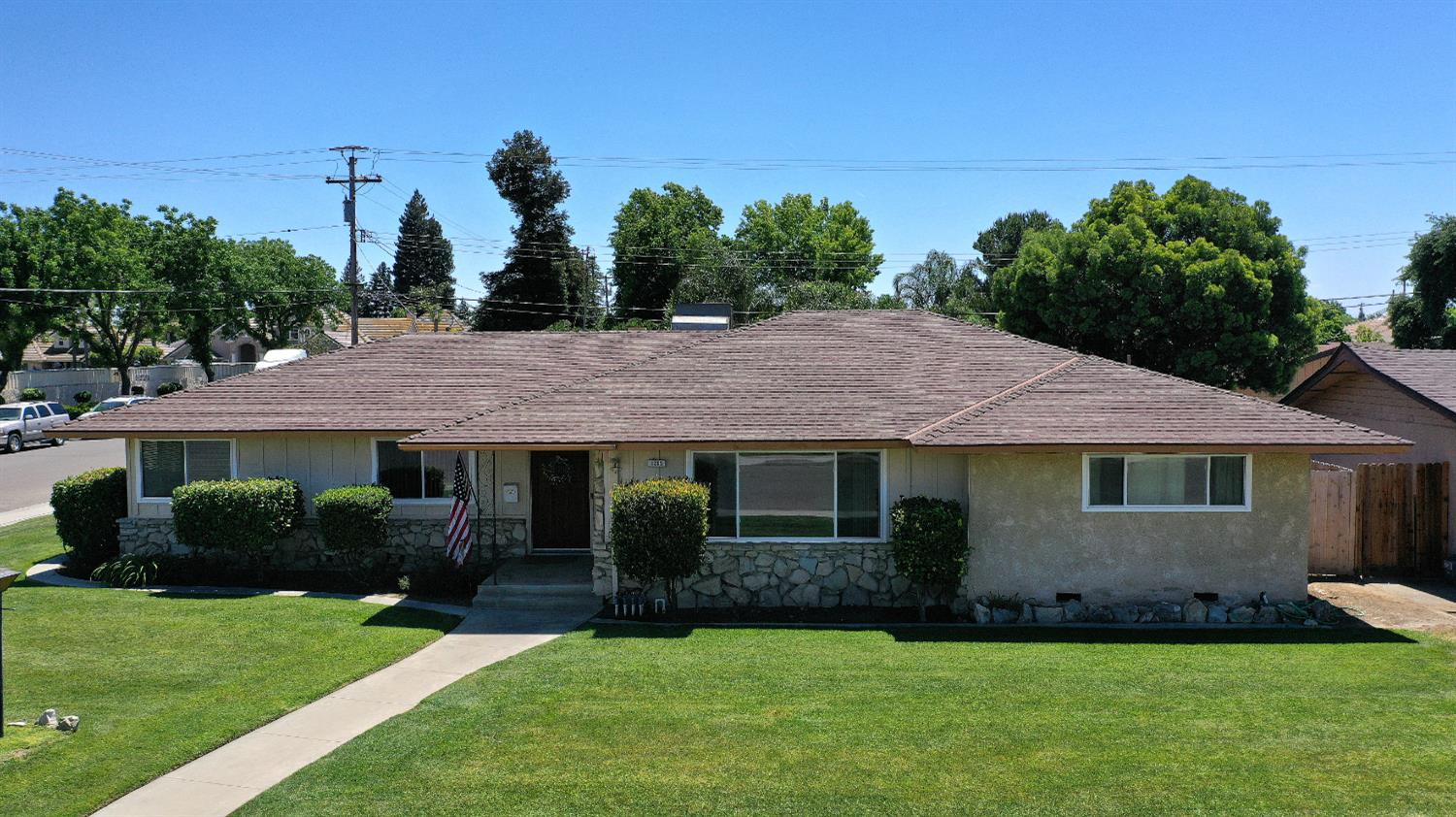 a front view of a house with a garden