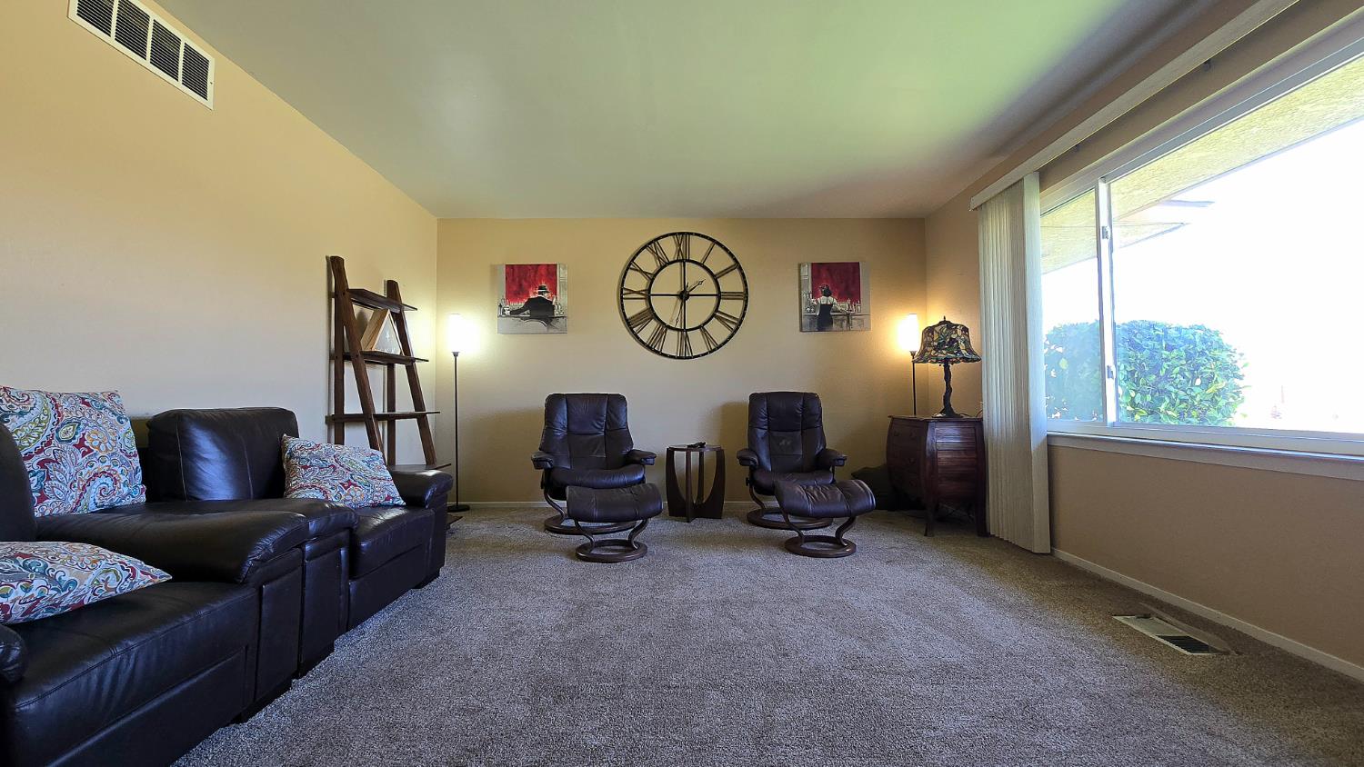 1205 Pine Street Selma, CA 93662 - Photo 12 of 41 a living room with furniture and a window