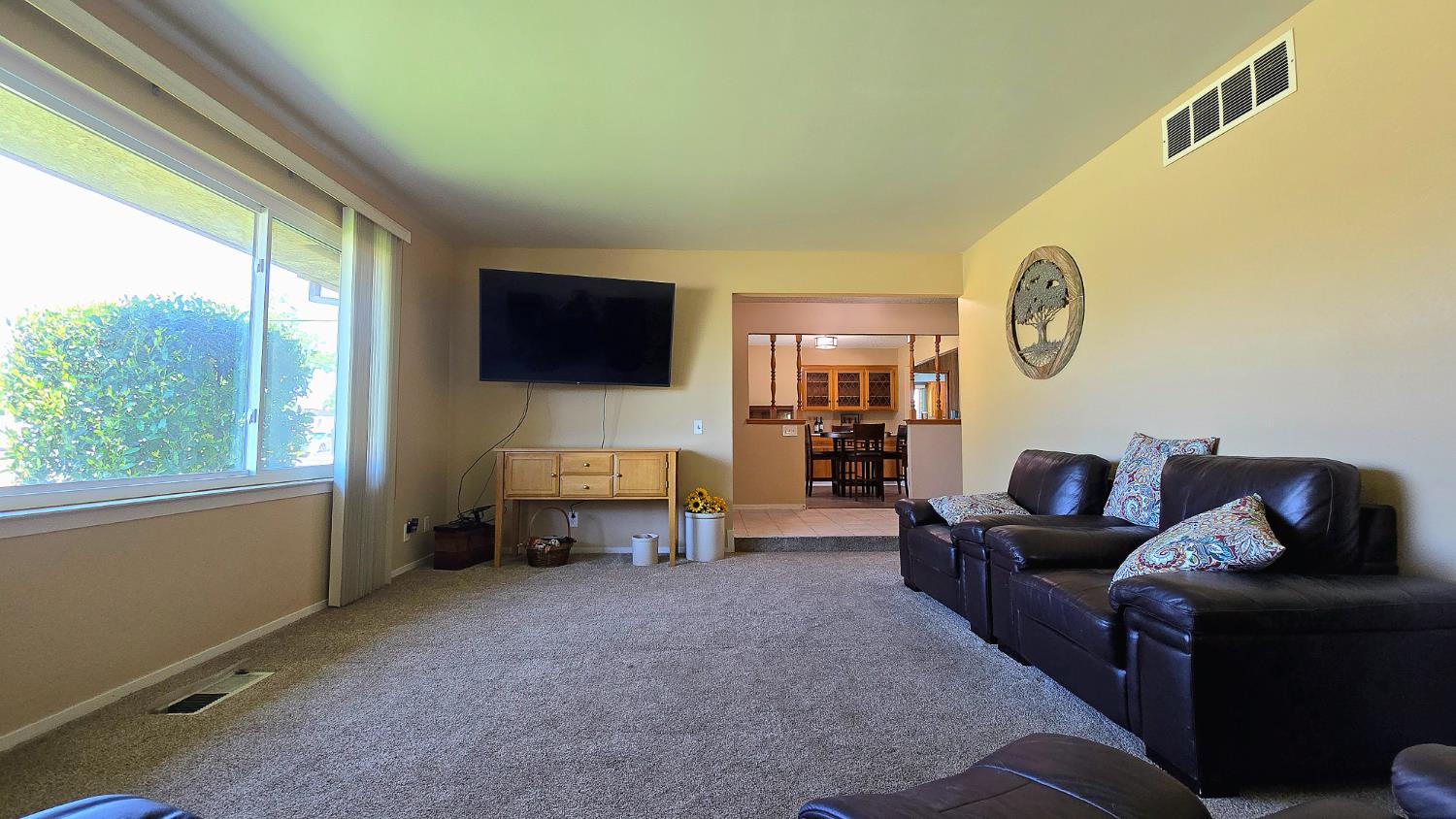 1205 Pine Street Selma, CA 93662 - Photo 13 of 41 a living room with furniture and a flat screen tv