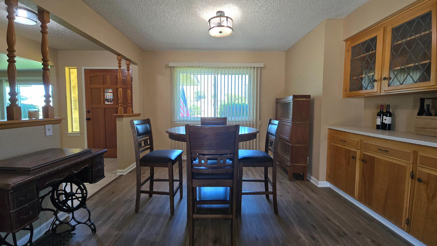 1205 Pine Street Selma, CA 93662 - Photo 15 of 41 a view of a dining room with furniture window and wooden floor