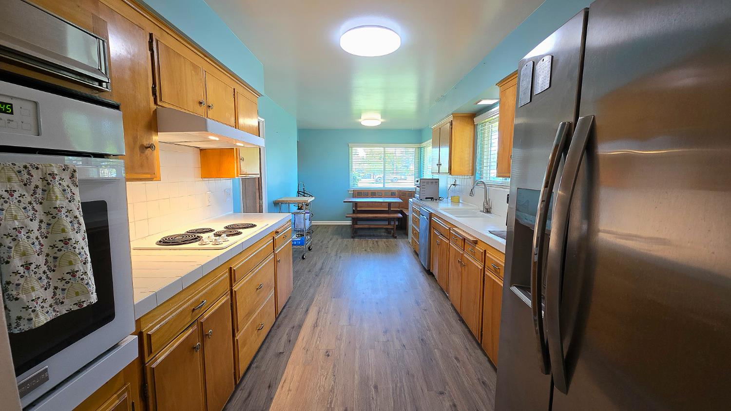 1205 Pine Street Selma, CA 93662 - Photo 19 of 41 a kitchen with stainless steel appliances granite countertop a stove a sink and a refrigerator