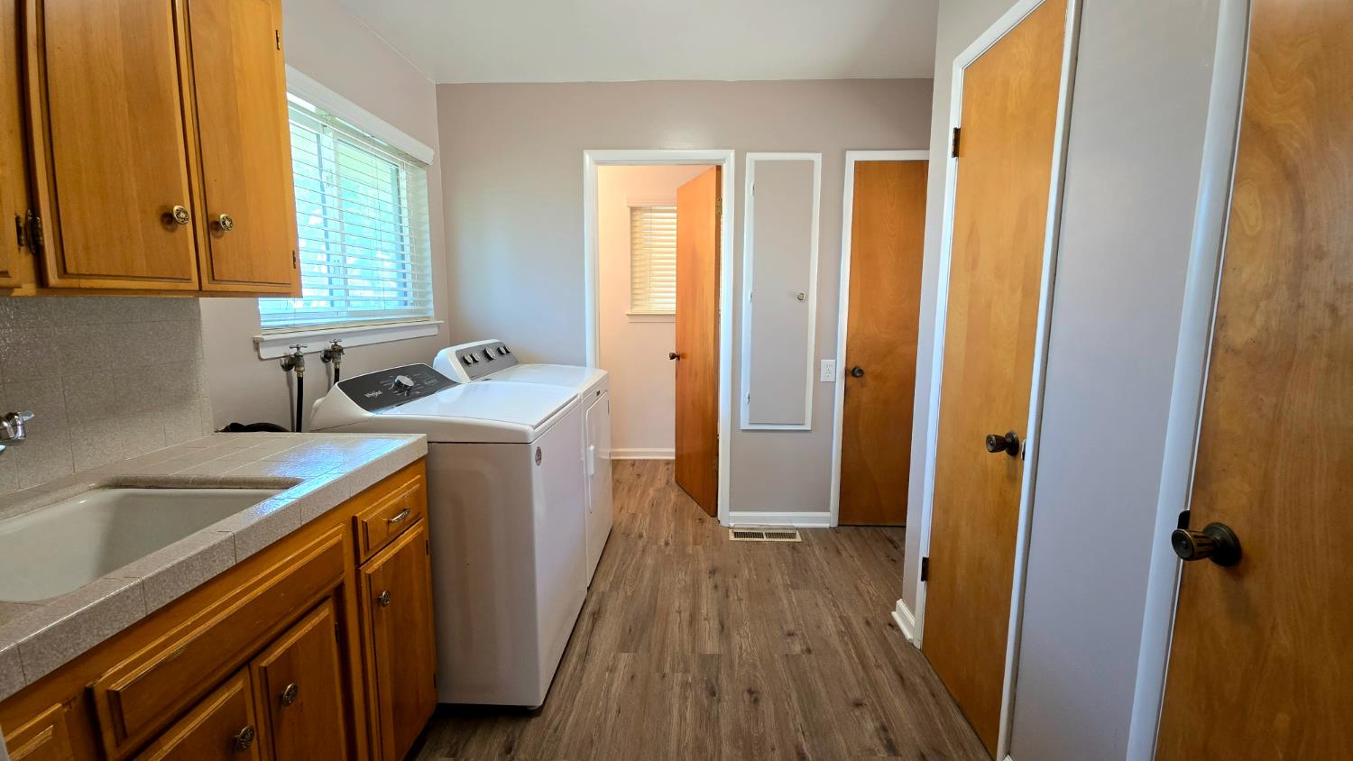 1205 Pine Street Selma, CA 93662 - Photo 23 of 41 a kitchen with a sink a window and appliances