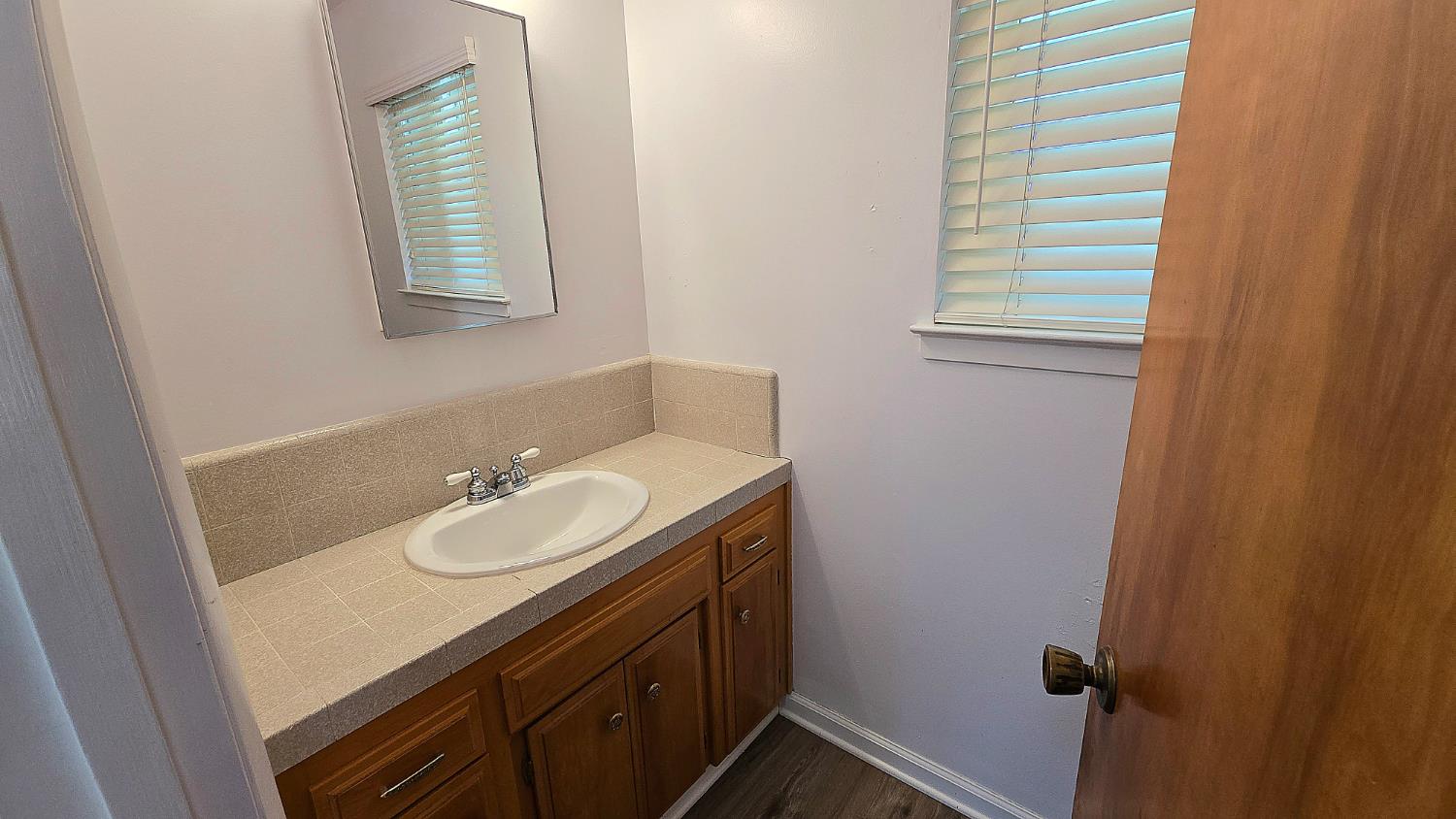 1205 Pine Street Selma, CA 93662 - Photo 24 of 41 a bathroom with a sink and a mirror