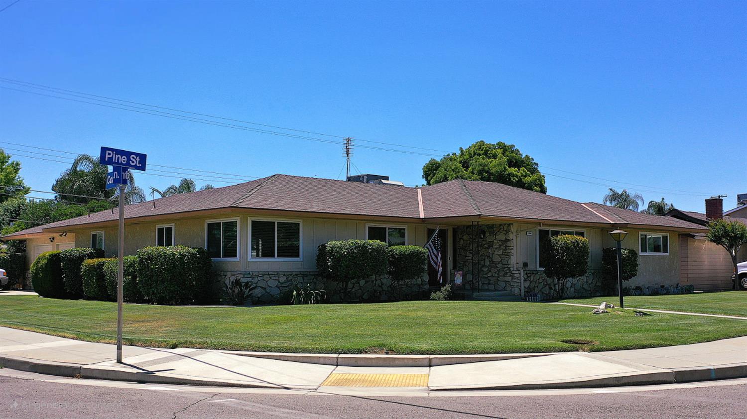 1205 Pine Street Selma, CA 93662 - Photo 3 of 41 a front view of a house with a garden