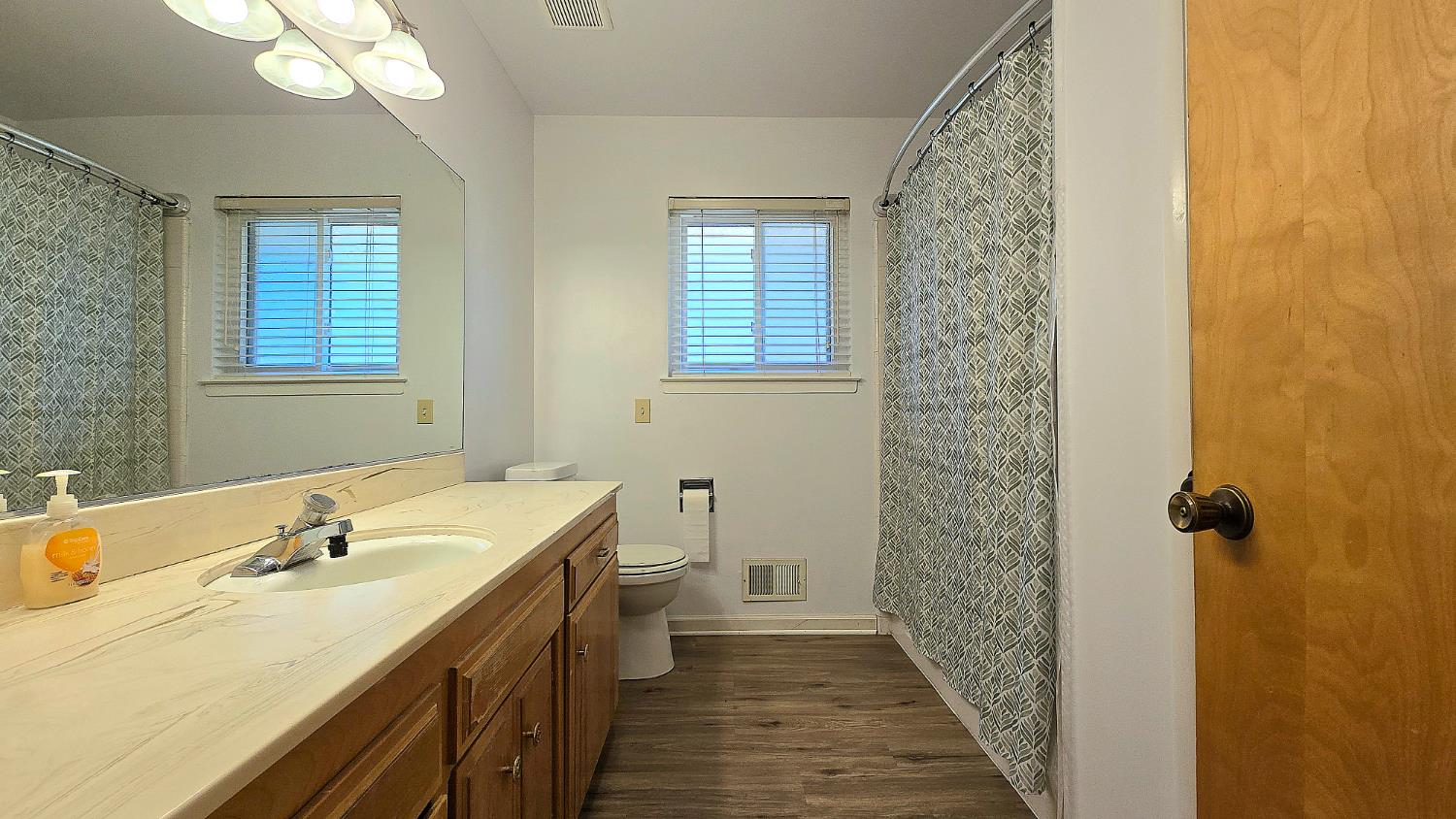 1205 Pine Street Selma, CA 93662 - Photo 33 of 41 a bathroom with a sink a toilet and shower
