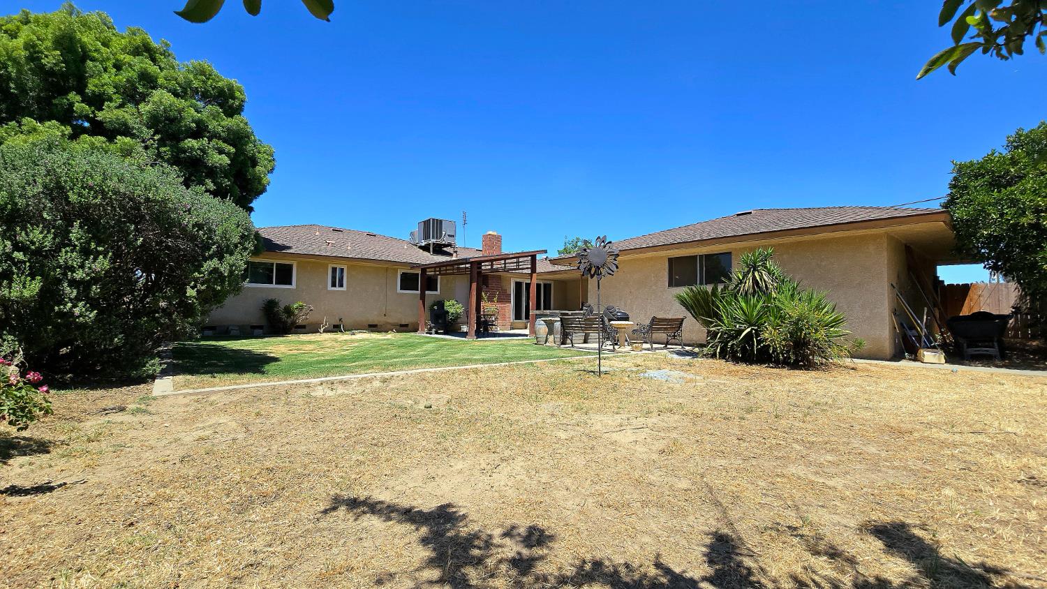 1205 Pine Street Selma, CA 93662 - Photo 39 of 41 a front view of a house with a yard and garage