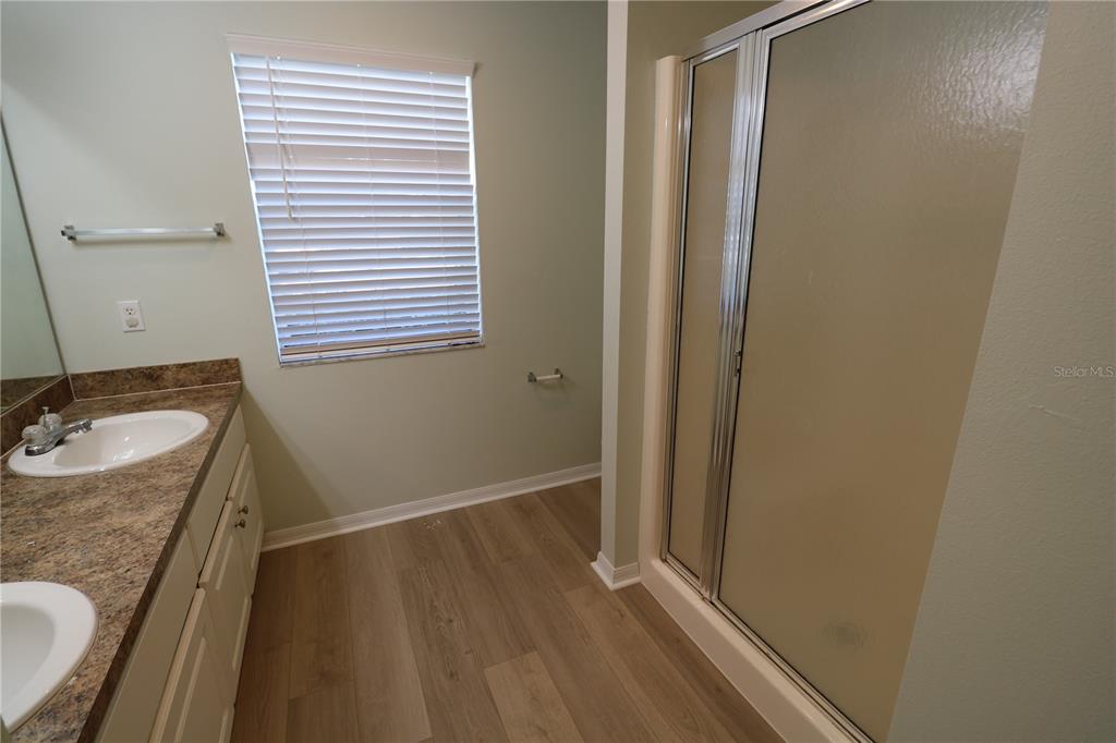6750 Moonglow Drive, Unit 102 Port Richey, FL 34668 - Photo 15 of 26 a bathroom with a sink and a mirror
