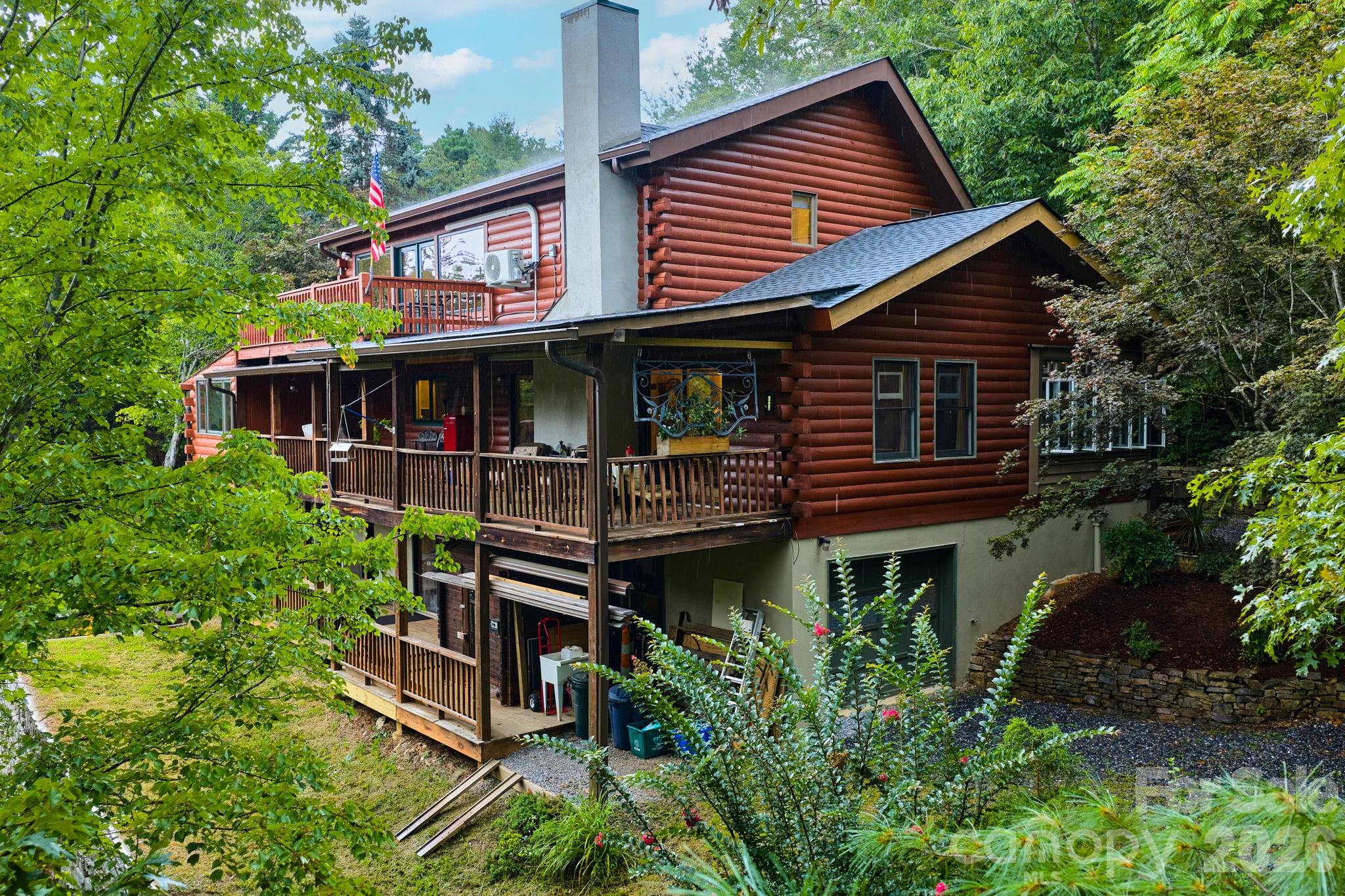 150 Avondale Ridge Road Asheville, NC 28803 - Photo 44 of 45 a view of house with roof deck and entertaining space