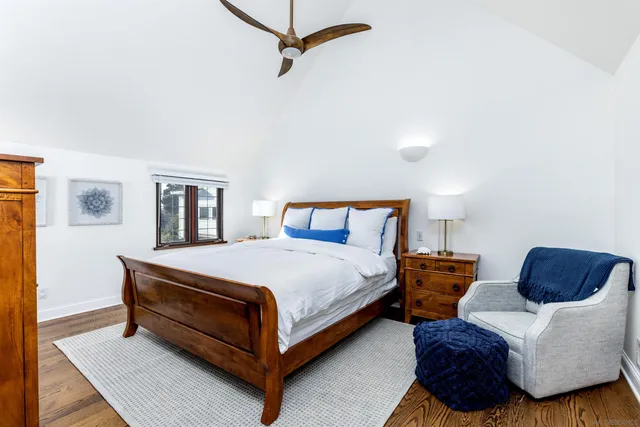 a bedroom with bed and a window