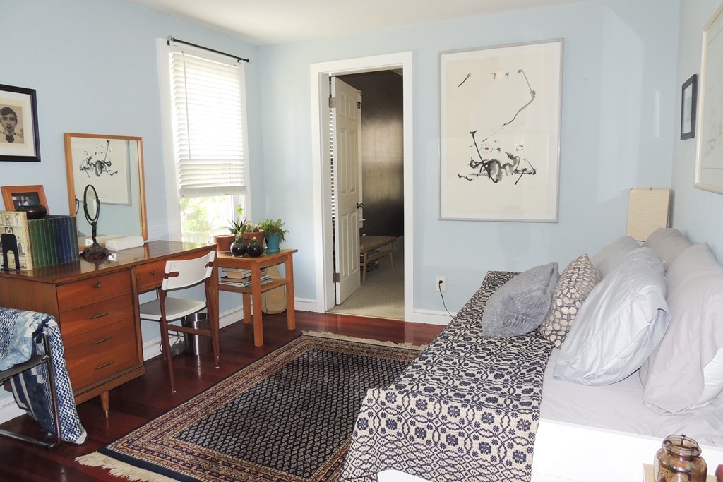 165 Marsden Street Springfield, MA 01109 - Photo 14 of 30 a bedroom with a bed and wooden floor