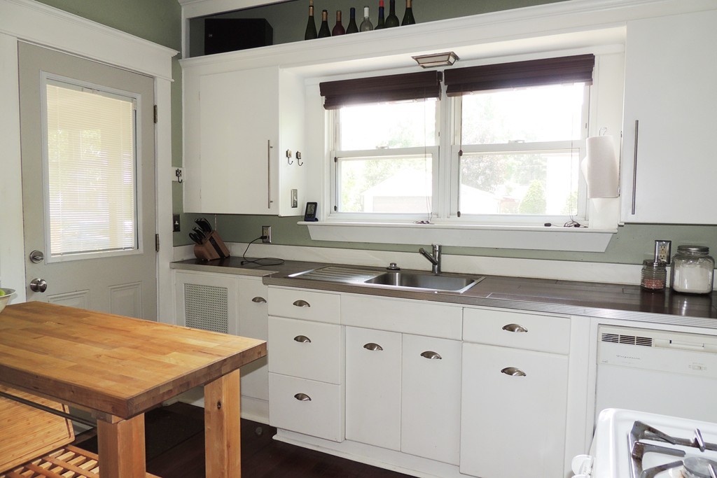 165 Marsden Street Springfield, MA 01109 - Photo 8 of 30 a kitchen with granite countertop a sink and a window