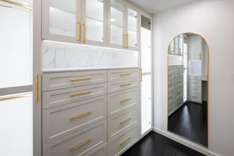 a view of walk in closet with empty racks