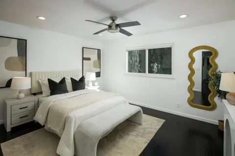 a bedroom with bed and window