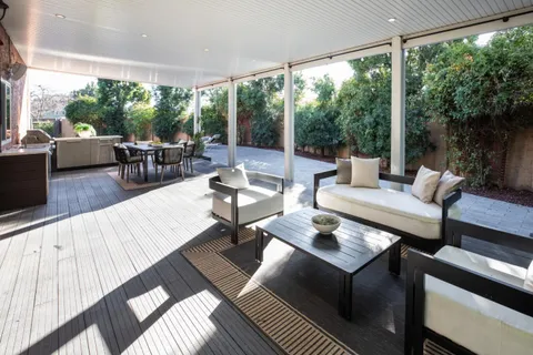 a outdoor living space with furniture and a large window