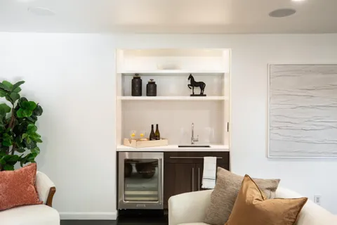 a living room with furniture and flowers