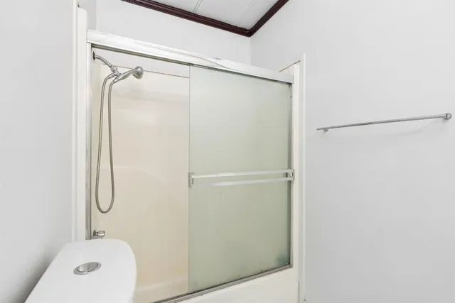 a view of an empty room with a window