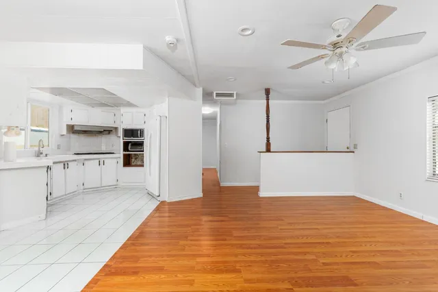 a view of kitchen with wooden floor and window