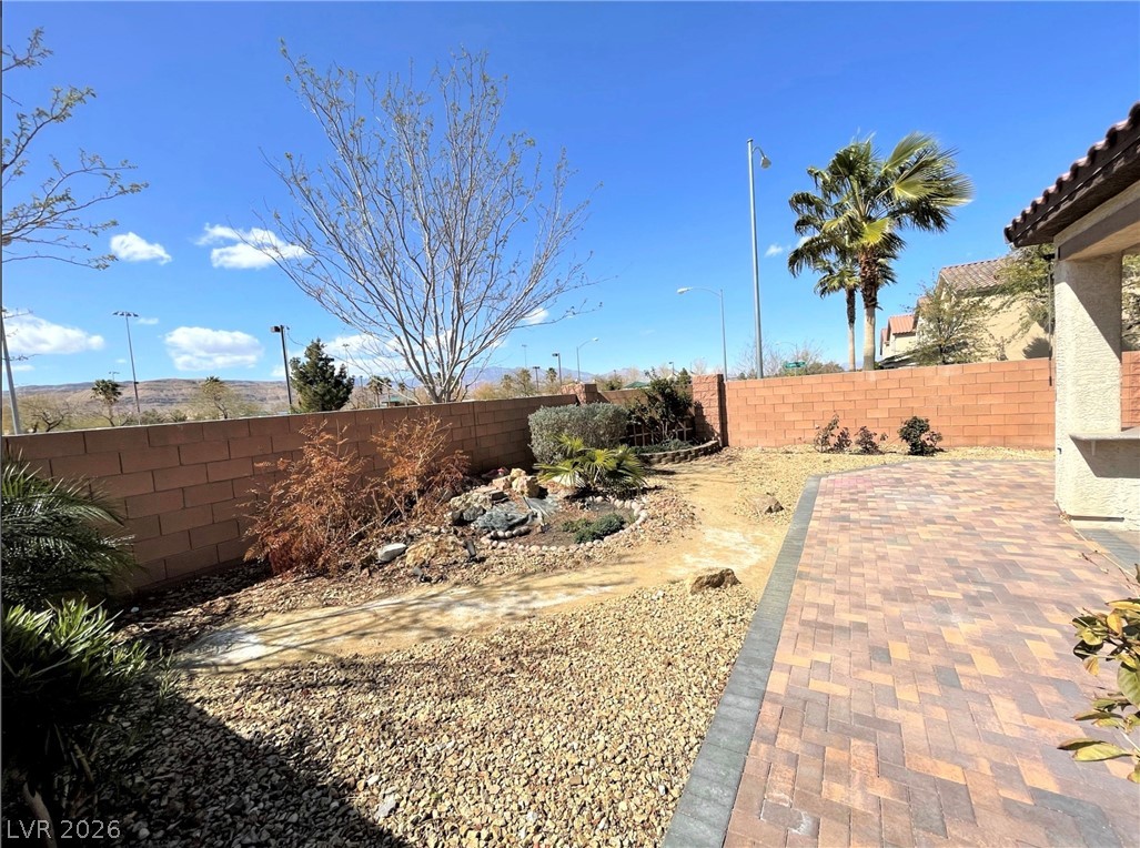 7063 Claythorn Road Las Vegas, NV 89148 - Photo 25 of 30 A desert-friendly landscape offers a paver patio and ample space for outdoor living.