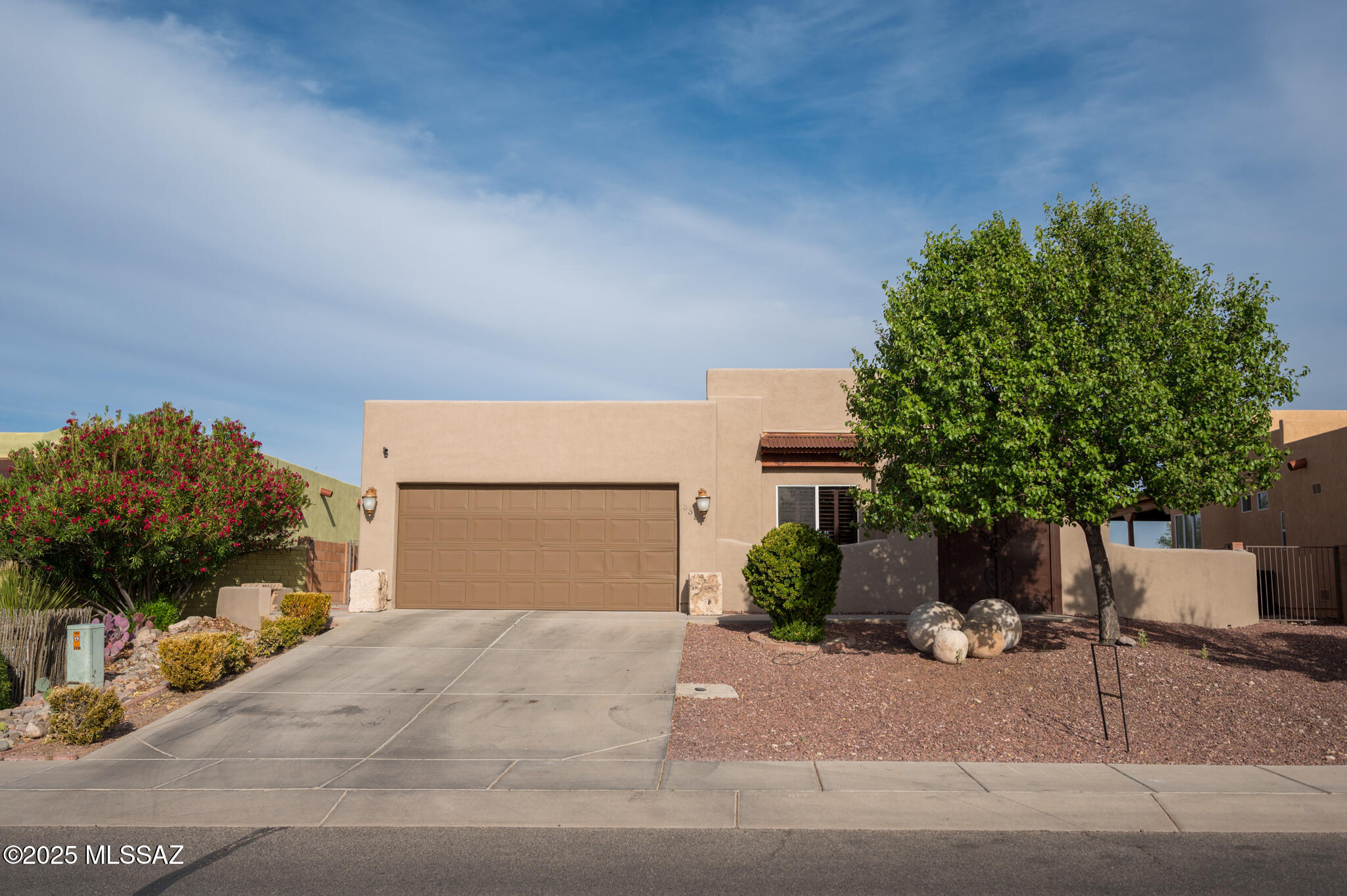 331 Via Bella Donna Rio Rico, AZ 85648 - Photo 37 of 46 a front view of a house with a yard and a garage