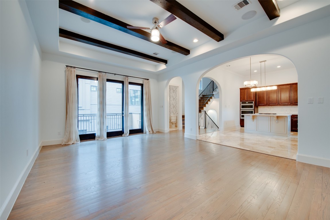 705 Malone Street, Unit B Houston, TX 77007 - Photo 19 of 39 wooden floor in an empty room with a window