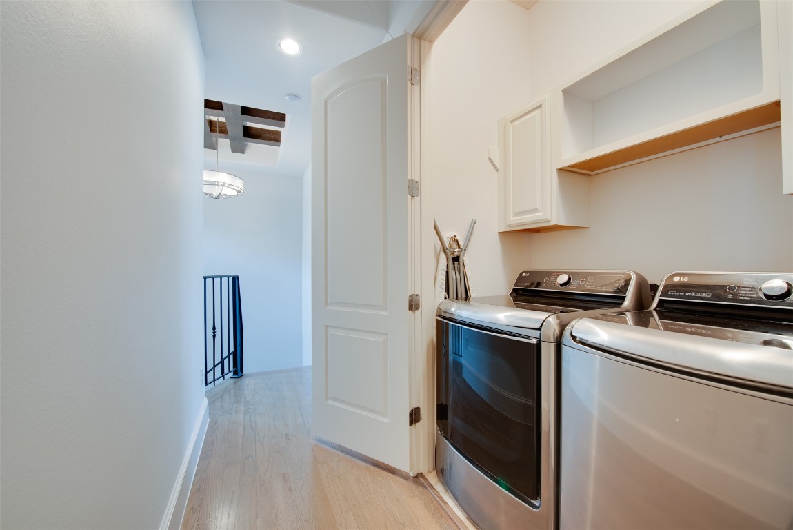 705 Malone Street, Unit B Houston, TX 77007 - Photo 29 of 39 a view of a kitchen with refrigerator and wooden floor