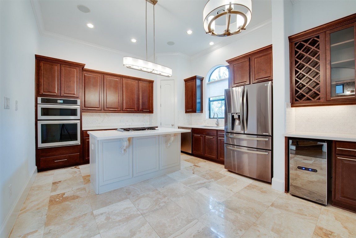 705 Malone Street, Unit B Houston, TX 77007 - Photo 9 of 39 a kitchen with stainless steel appliances granite countertop a refrigerator a oven a sink and a stove