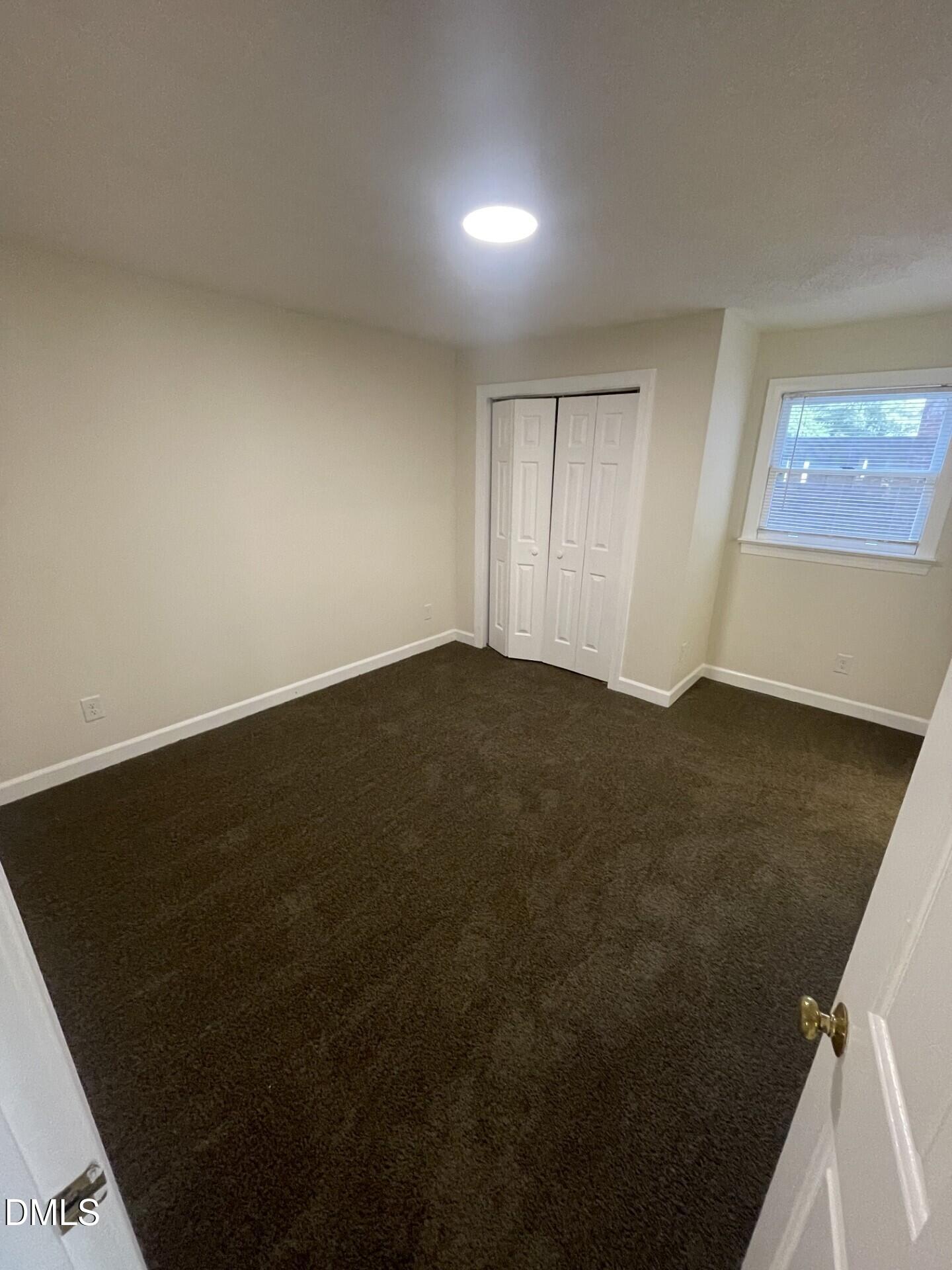 3535 Ivy Commons Drive, Unit 102 Raleigh, NC 27606 - Photo 8 of 9 a view of an empty room