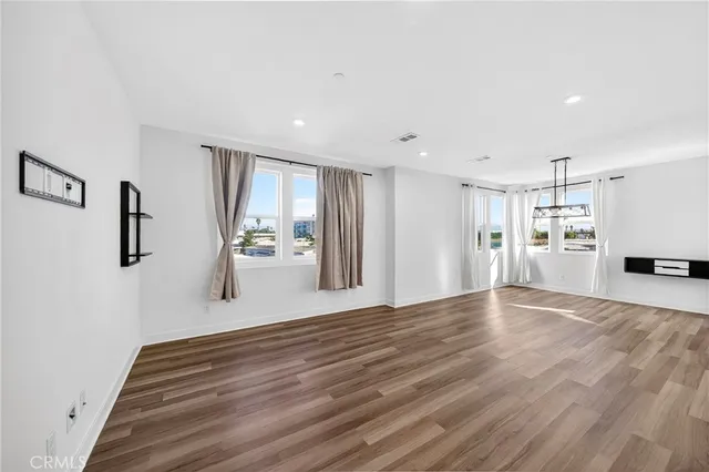 a kitchen with stainless steel appliances a stove top oven a sink and a refrigerator